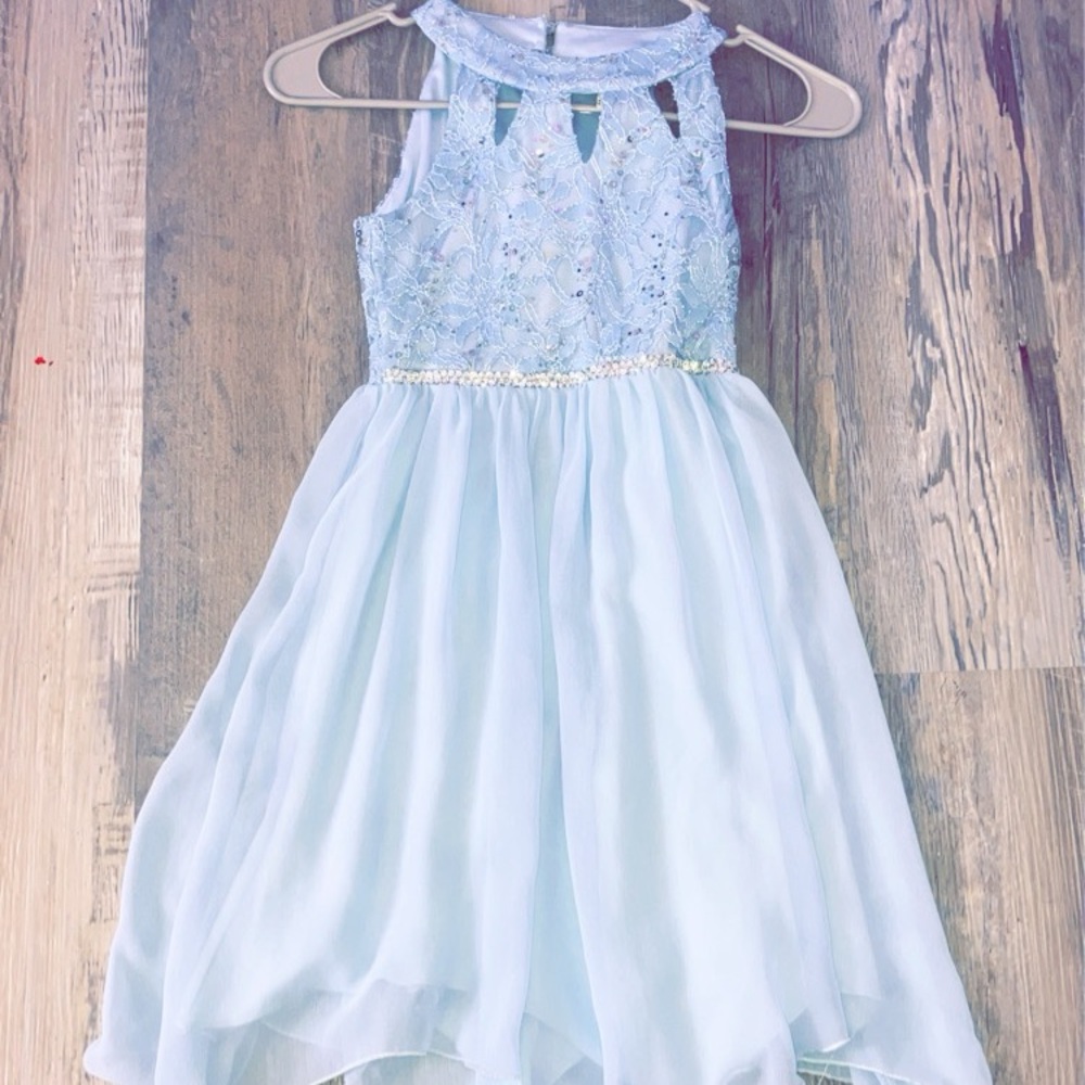 This dress has a very pretty design on the top. The bottom is two layered